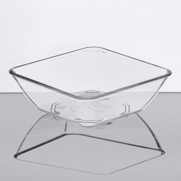 A clear square Dinex SAN plastic bowl.