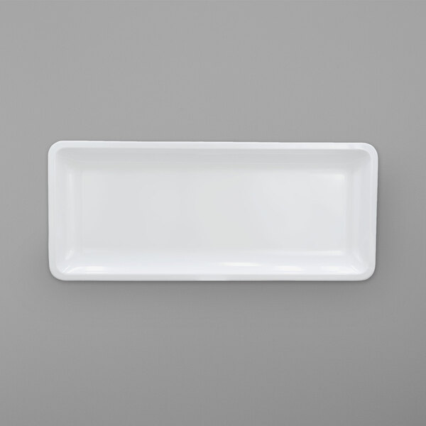 A white rectangular object on a gray background.