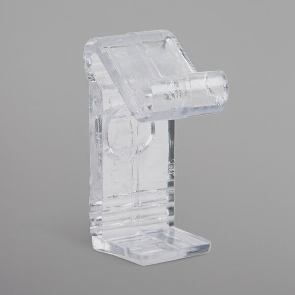 A clear plastic Snap Drape C skirt clip.