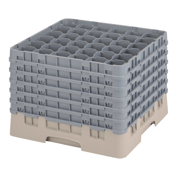 A beige plastic Cambro glass rack with many compartments and 6 extenders.