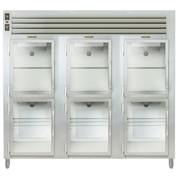 A close-up of a Traulsen pass-through heated holding cabinet with glass doors.