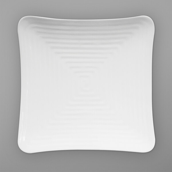 A white square Elite Global Solutions melamine plate with a curved wavy design.