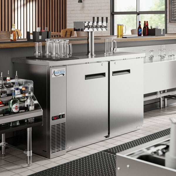 An Avantco stainless steel beer dispenser with taps.