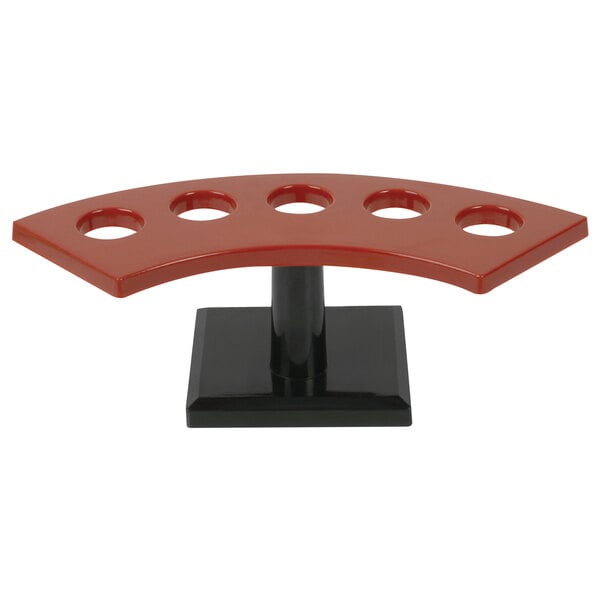 A red and black Thunder Group Sushi Hand Roll Rack with five holes.