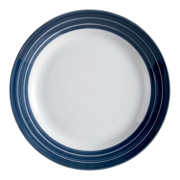 A close-up of a Libbey Lunar Bright white porcelain plate with blue stripes.