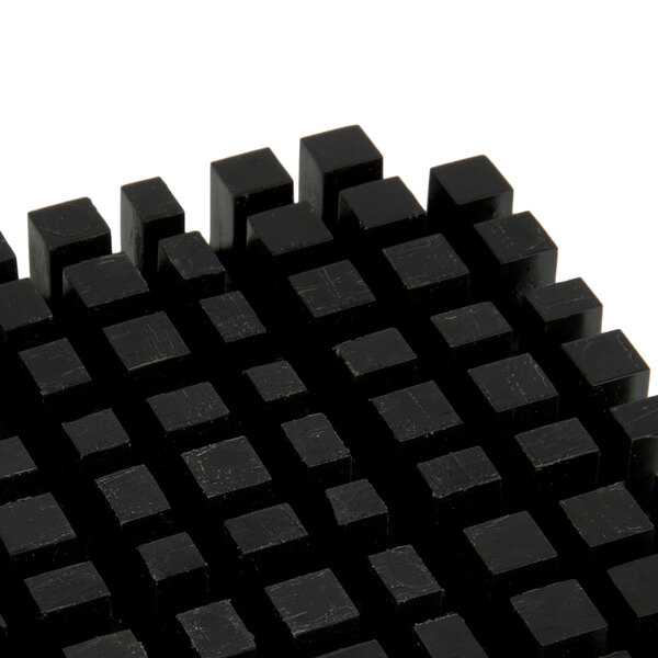 A black cube with squares on it.