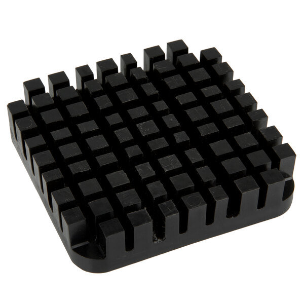A black square Nemco push block with many small squares.