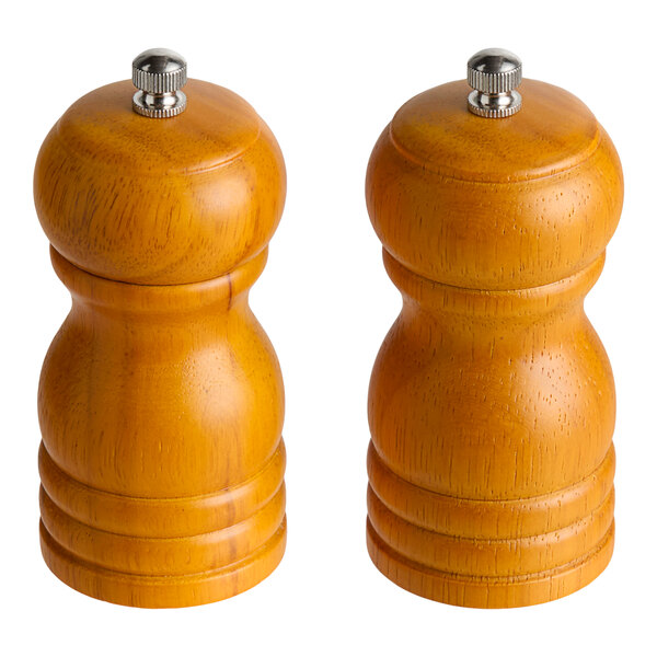 Two Acopa wooden pepper mills with silver metal.