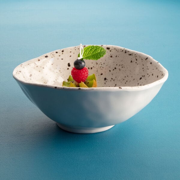 a bowl of fruit with a string