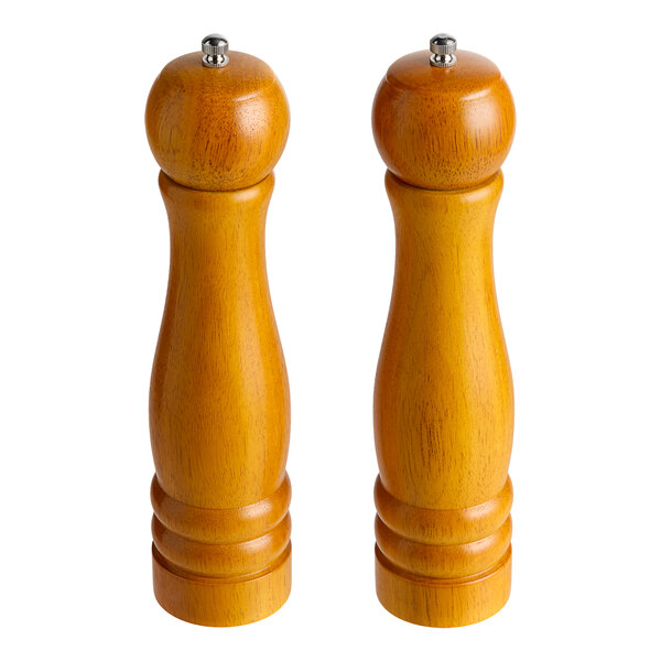 Two wooden Acopa salt and pepper mills with silver tops.