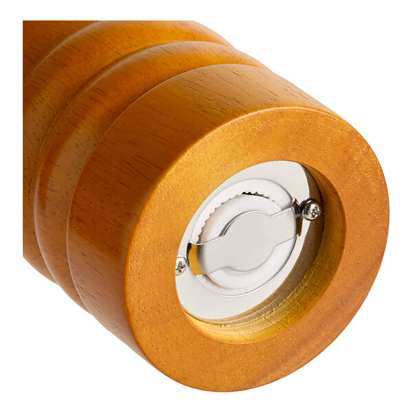 A close up of an Acopa wooden pepper mill with a metal knob on top.