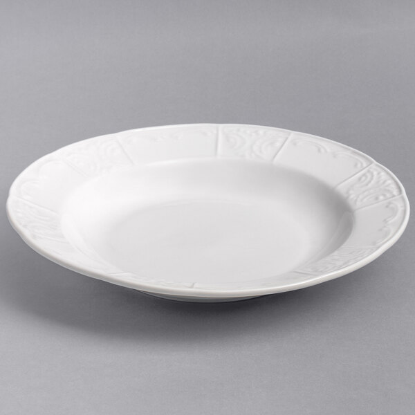 A Tuxton bright white china pasta bowl with a decorative design on it.