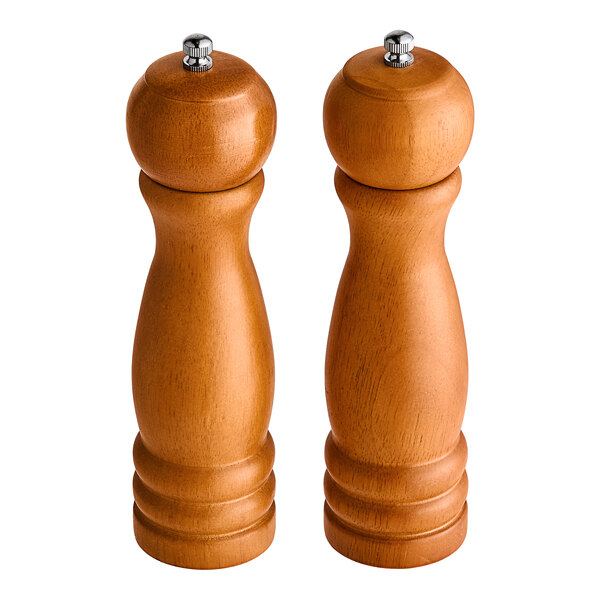 Two wooden Acopa pepper mills with a brown matte finish.
