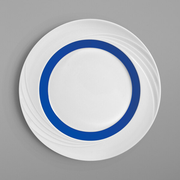 A white Schonwald porcelain plate with a blue rim.