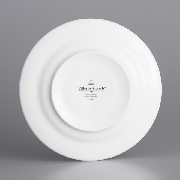 A white Villeroy & Boch Neufchatel saucer with a white rim.