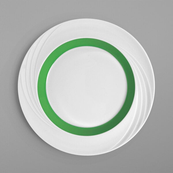 A stack of Schonwald Donna Senior porcelain plates with white centers and green rims.