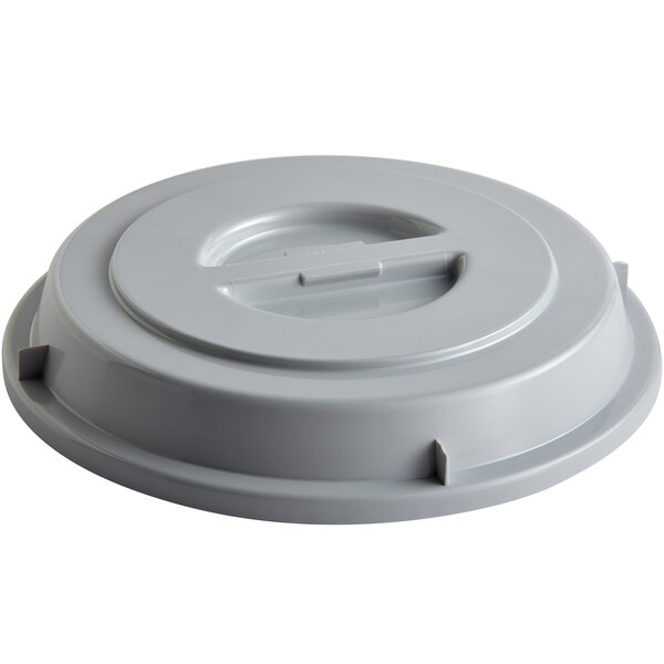 A gray plastic Schonwald plate cover with a circular hole and a handle.