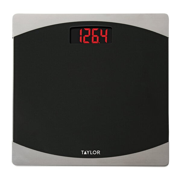 A black Taylor digital bathroom scale with red numbers.