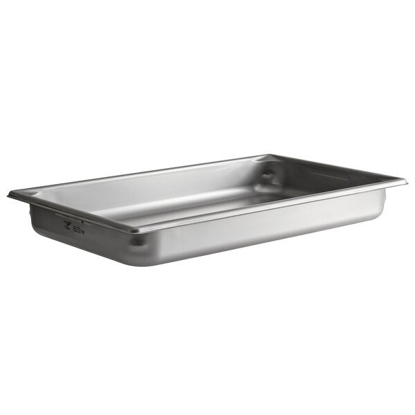 A Vollrath stainless steel hotel pan with a lid on a counter.