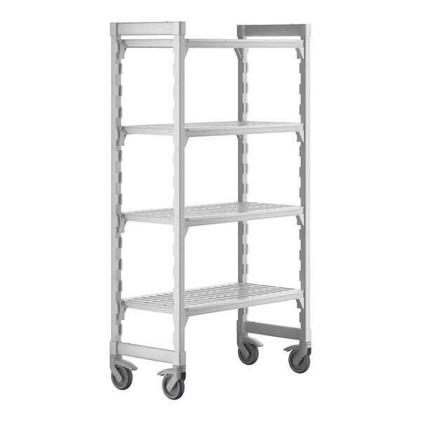A white plastic Cambro Camshelving Premium mobile shelving unit with four shelves and wheels.