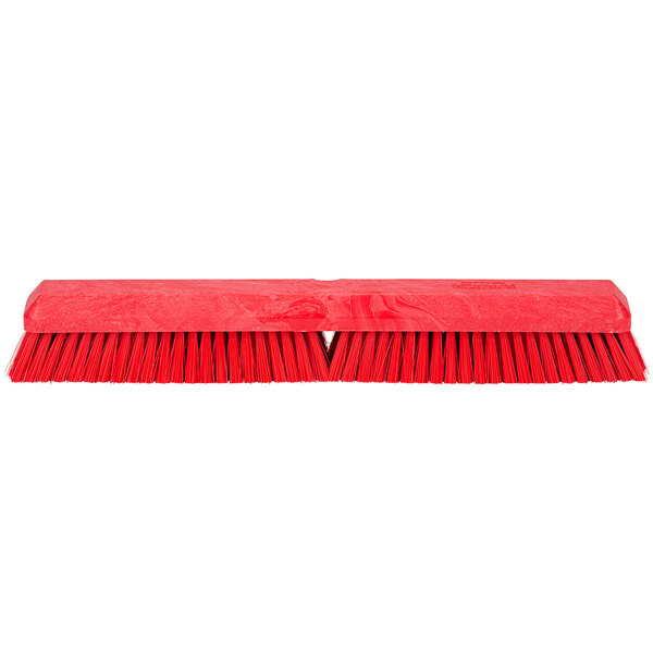 A red Carlisle Sparta Omni Sweep push broom head with long bristles.