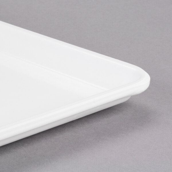 A close-up of a white Cambro dietary tray.