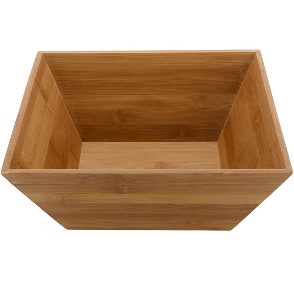 A square bamboo bowl with a white liner inside.