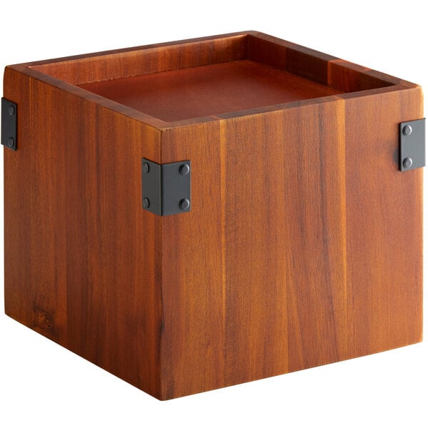 A walnut square wooden box with metal corners.