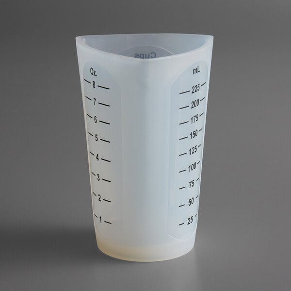 A Tablecraft flexible silicone measuring cup with black measurement lines on a white background.