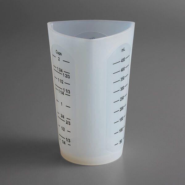 A Tablecraft flexible silicone measuring cup with a measuring scale on the side.