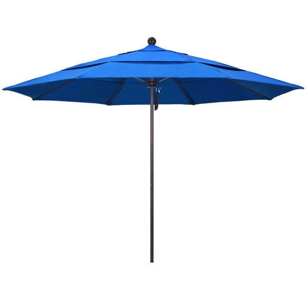 A royal blue California Umbrella with a bronze pole.