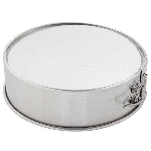 A round metal Chicago Metallic springform cake pan with a metal lock.