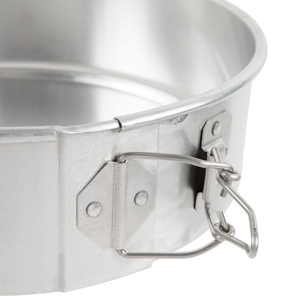 A Chicago Metallic aluminum springform cake pan with a latch.