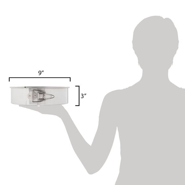 A woman using a Chicago Metallic Springform Cake Pan to make a cake.