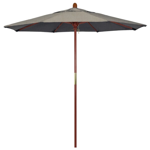A California Umbrella with a hardwood pole and grey Sunbrella canopy.