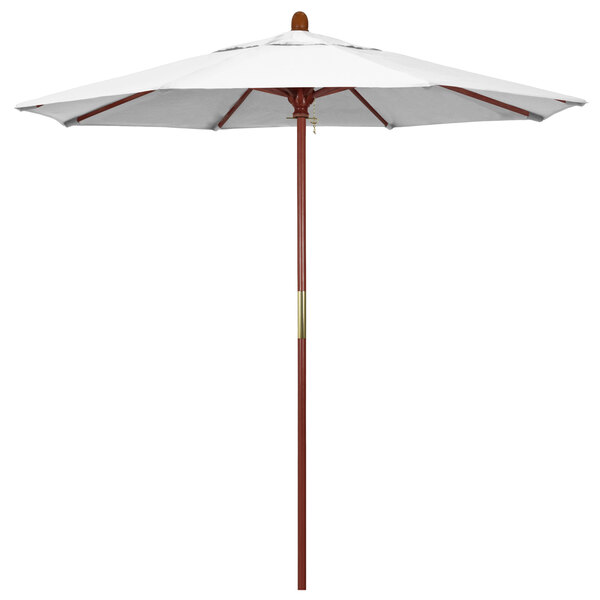 a white umbrella with a brown pole