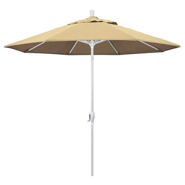 A close-up of a beige California Umbrella with a white pole.