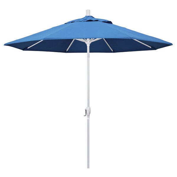A blue California Umbrella with a white pole.