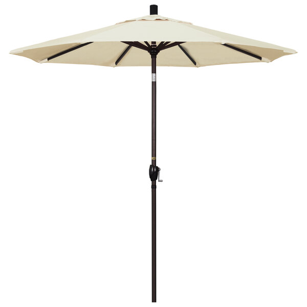 A white umbrella with a bronze pole.