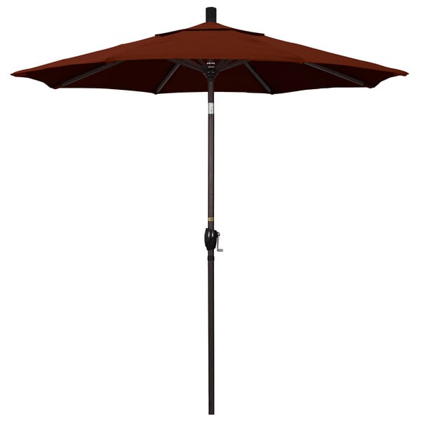 A brown California Umbrella with a bronze pole.