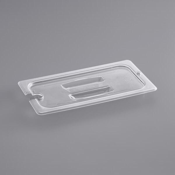 A clear plastic polycarbonate lid with a handle and spoon notch.