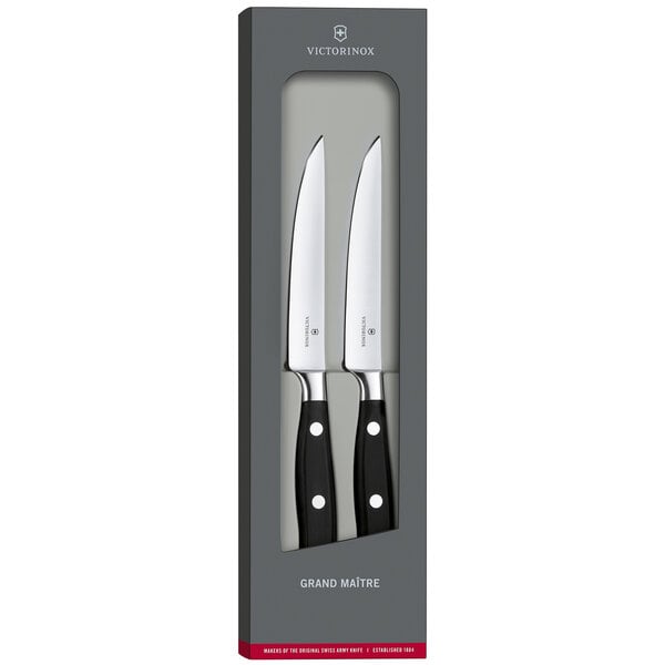 Two Victorinox Grand Maitre steak knives in a box.