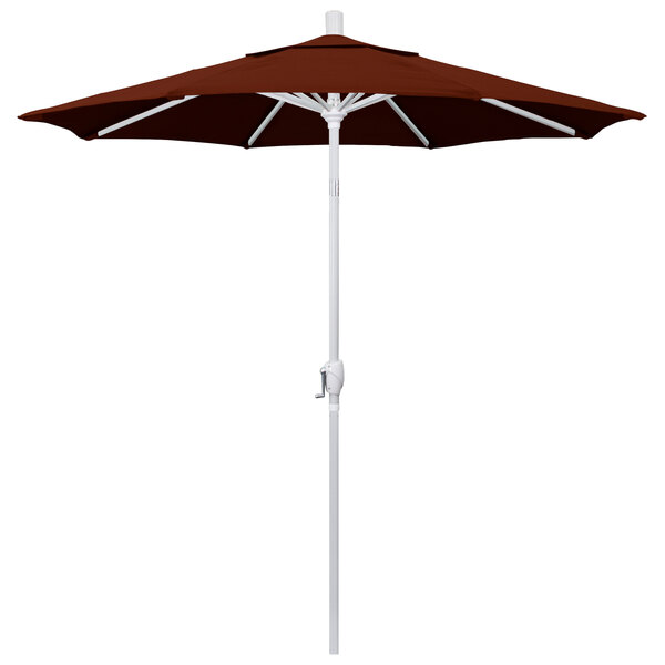 A close-up of a brown California Umbrella with a white pole.