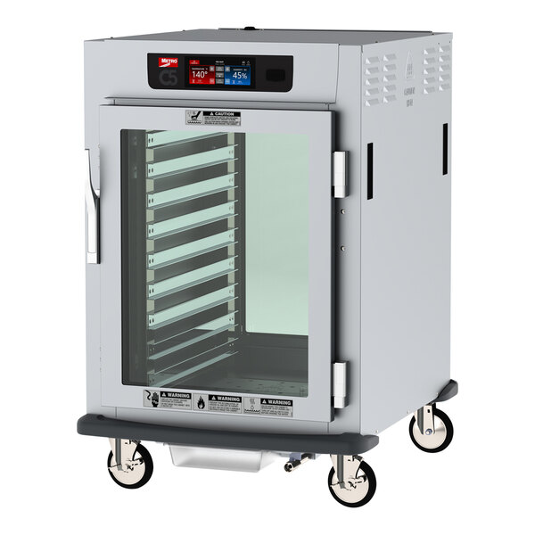 A white Metro C5 pass-through heated holding and proofing cabinet with clear glass doors.
