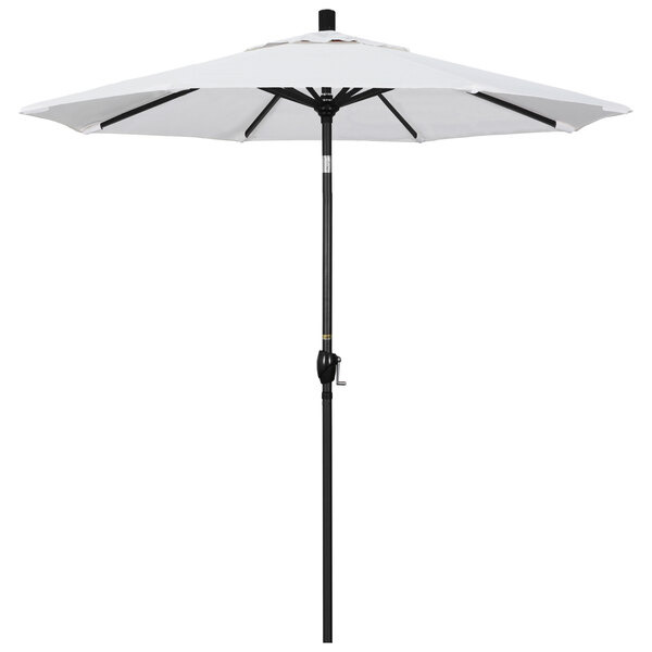 A white California Umbrella with a black pole.