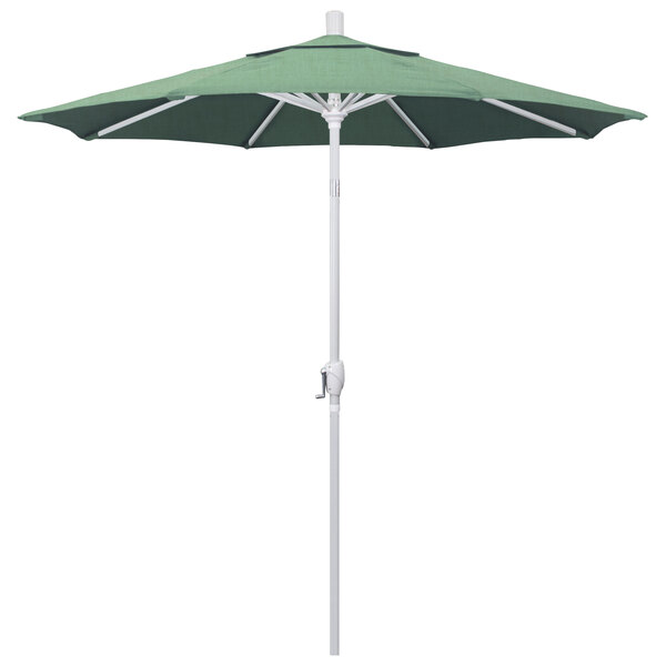 A green California Umbrella on a white pole.