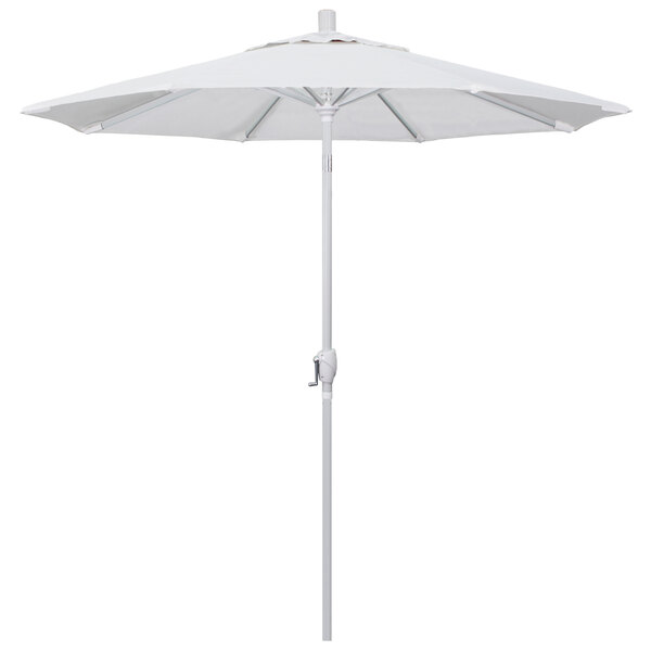 A natural fabric California Umbrella with a white top and pole.