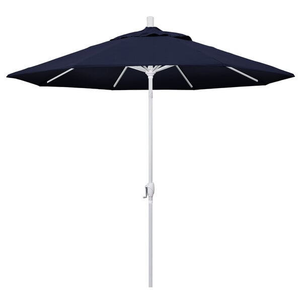 A navy blue California Umbrella with a white pole.