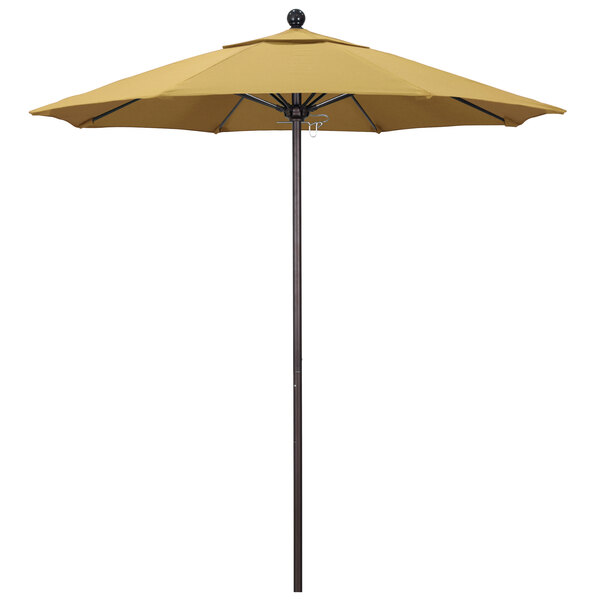 A yellow California Umbrella with a bronze pole on a white background.