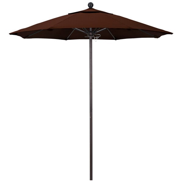 A brown California Umbrella on a bronze pole.